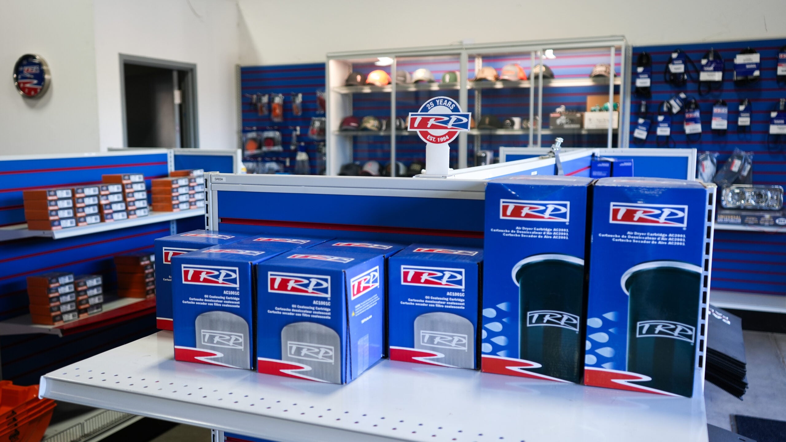 TRP truck merchandise New Zealand products displayed in store, featuring air dryer cartridges and filters.
