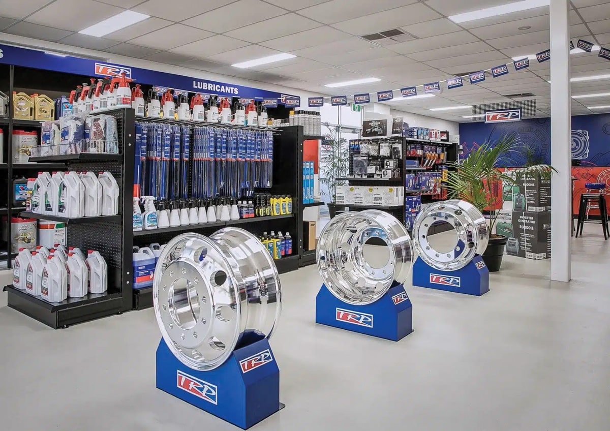 Truck cleaning supplies displayed in a shop with various lubricants and cleaning products.