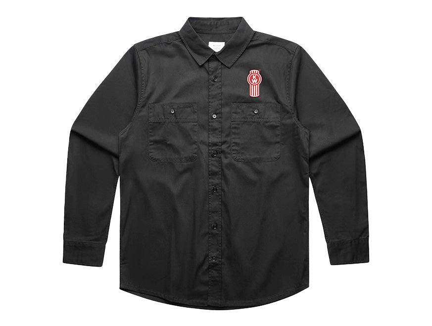 The SHIRT KW DRILL BLACK is a smart black, long-sleeve shirt with two chest pockets and a red-and-white embroidered oval S patch above the left pocket—perfect for a professional look.