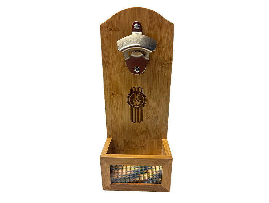 The BOTTLE OPENER KW WALL MOUNT is a wooden, wall-mounted bottle opener with a metal top, cap-catching box, and an engraved circular Kenworth logo—perfect for mancaves.