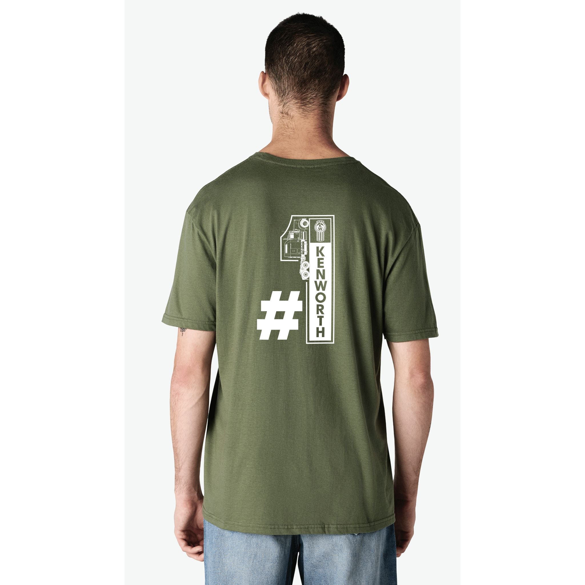 A man is seen from behind wearing the TEE SHIRT KW NO1 GREEN, which features a large white number one with a hashtag and "KENWORTH" printed vertically inside the number.