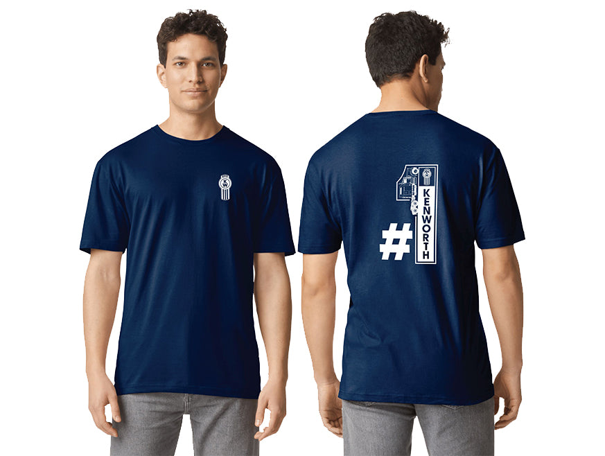 A man wears the TEE SHIRT KW NO1 NAVY, featuring a small white Kenworth logo on the left chest and a bold back graphic with a key, hashtag symbol, and "Kenworth" in large letters.