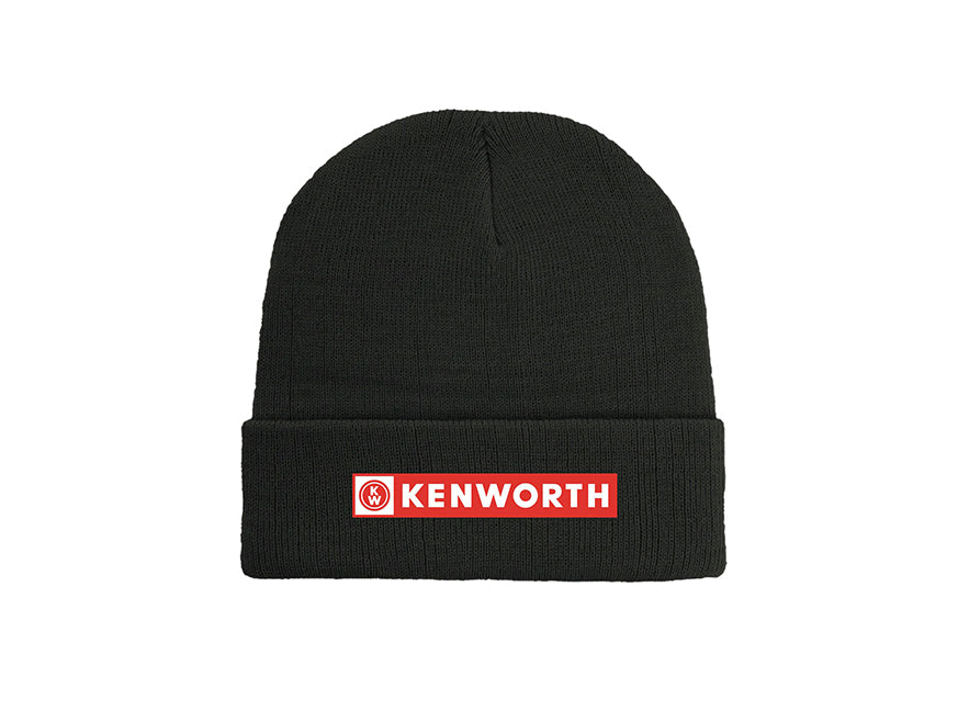 The BEANIE KW BANNER BLACK is a black knit beanie with a folded brim and a red and white rectangular Kenworth logo patch on the front—perfect for keeping warm outdoors.