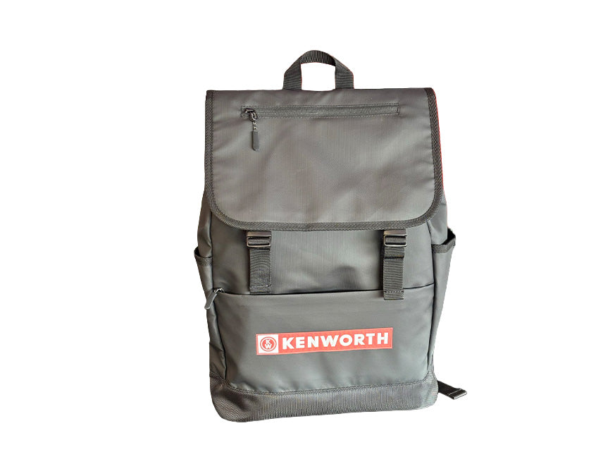 The BACKPACK KW ROLL TOP is a grey Kenworth roll top backpack with a flap cover, front zipper pocket, black straps, and the red and white KENWORTH logo—durable and perfect for everyday use. Shown on a white background.