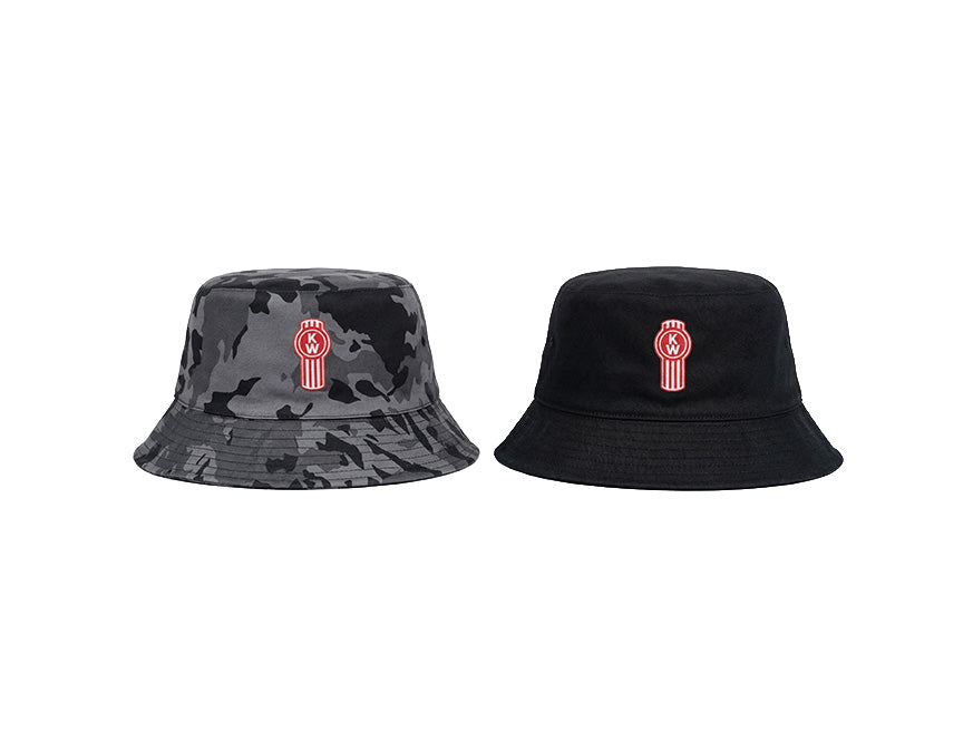 The Kenworth Bucket Black/Camo Reversible hat is shown in both styles: one side features a black and gray camo pattern, the other is solid black. Both sides display a red and white embroidered circular logo on the front.