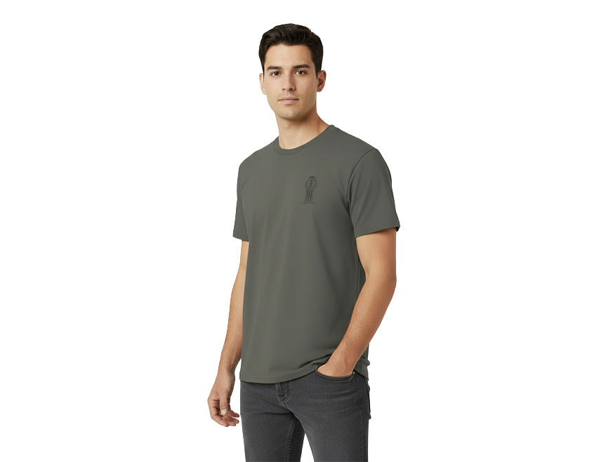 A man wearing the Kenworth Legacy T-Shirt Grey and dark jeans stands against a white background, looking at the camera with a neutral expression.