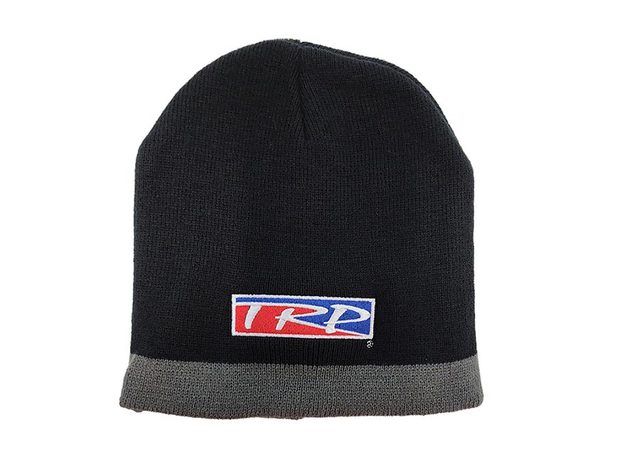 The BEANIE TRP BLACK/GREY is a black and grey beanie with a gray trim, featuring a rectangular patch with "TRD" in red and blue on white—ideal for keeping warm on chilly days.