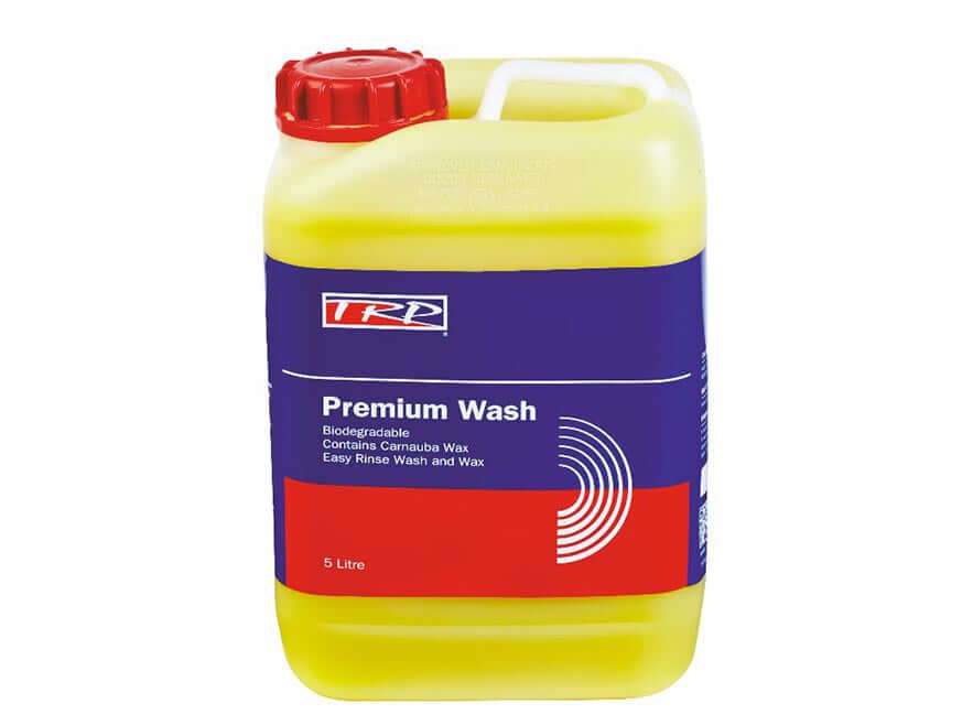 A yellow 5L plastic container of TRUCK WASH PREMIUM TRP with a red cap and blue, red, and white label—biodegradable, contains carnauba wax for easy rinse, premium wash and wax, provides a high-gloss finish.