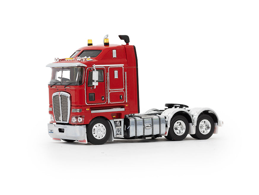 The MODEL K200 RED is a red cab-over scale model truck with chrome accents and two rear axles, photographed on a white background without a trailer.