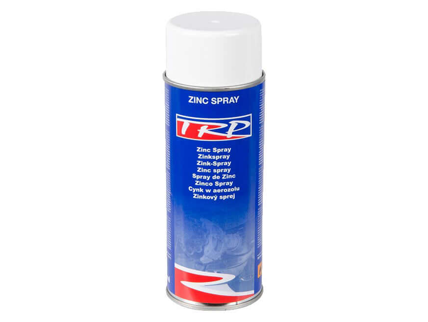 The TRP Zinc Spray features a blue and white can with a white cap, red detail near the bottom, and multilingual labeling. It offers fast-drying protection and rust prevention for metal surfaces.
