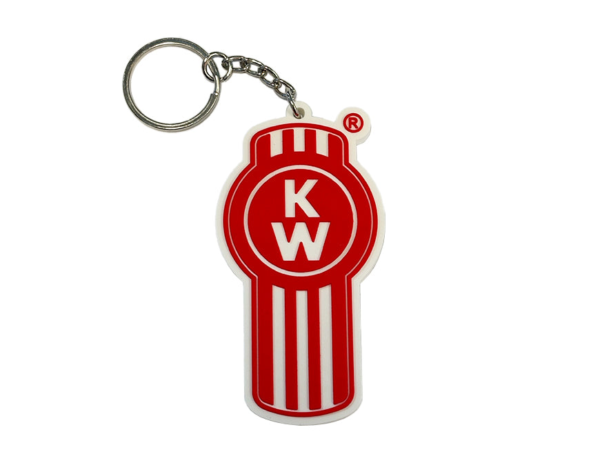 The KEYRING KW RUBBER features a rubberised red and white Kenworth Bug logo design with K and W in a circle, vertical stripes beneath, and a durable metal key ring.