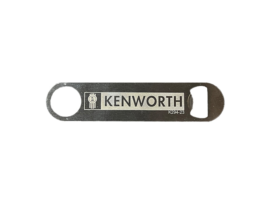 The BOTTLE OPENER KW is a flat metal bottle opener with a hole and an opening at opposite ends, engraved with the Kenworth logo and name—a great gift for any Kenworth fan.