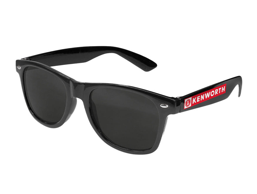 SUNGLASSES KW: Wayfarer-style shades with black frames, dark lenses, and a glossy finish. The left temple arm features a bold red KENWORTH logo—ideal for driving and everyday style.
