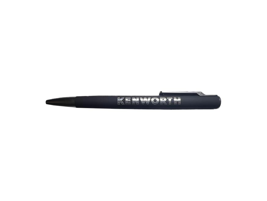 The PEN KW BLACK is a dark blue recycled pen with a black tip and clip, featuring "KENWORTH" in silver on the barrel—an eco-friendly choice for sustainable office supplies, shown on a white background.