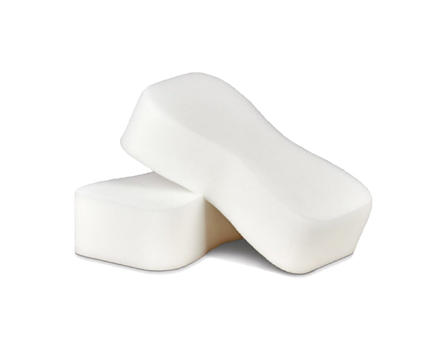Two white, rectangular Jumbo Sponges with curved edges are stacked on a white background—one lies flat while the other is propped diagonally on top.